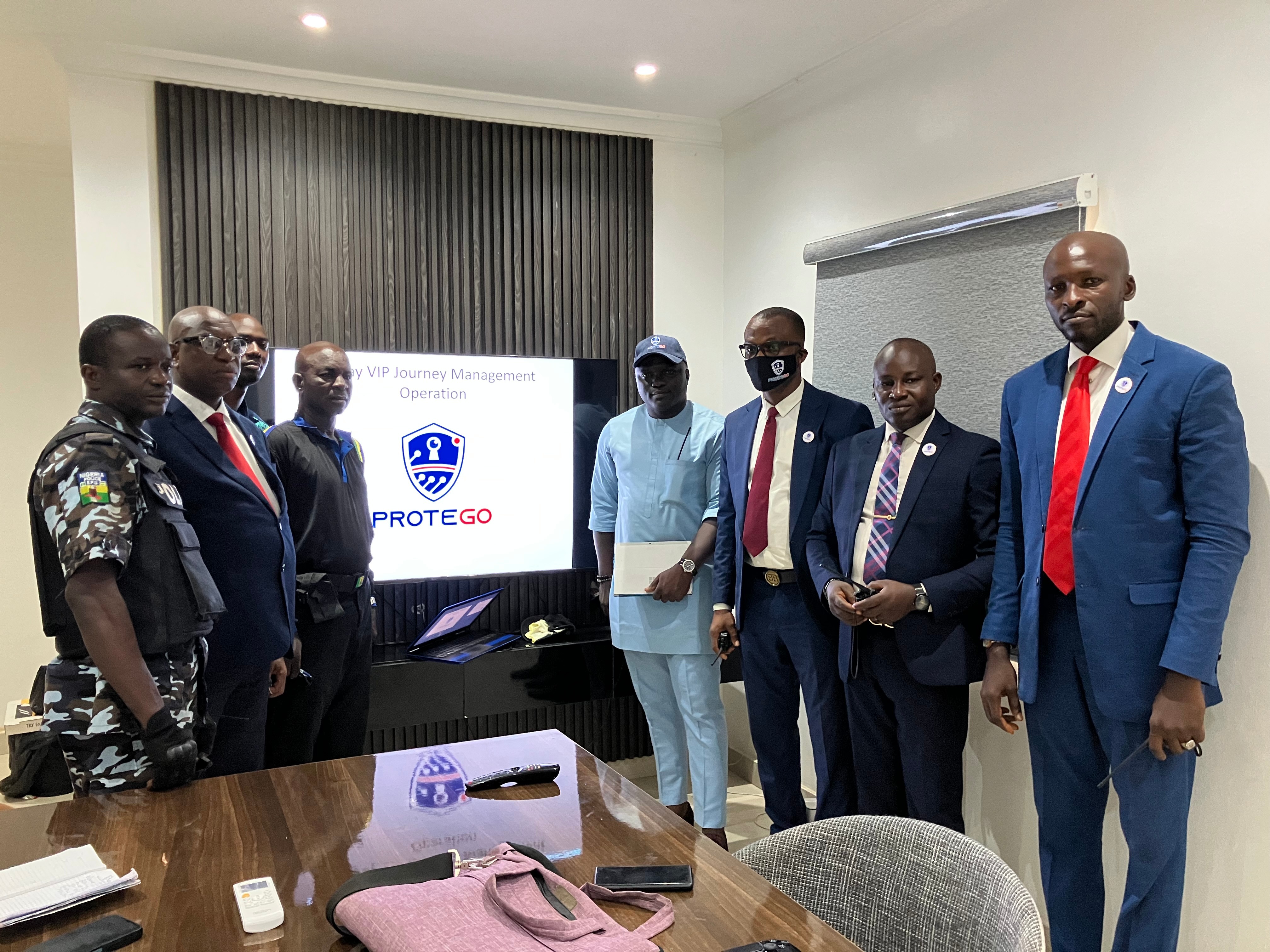 Protego Integrated Services leadership team and security professionals in Lagos conference room discussing security strategies